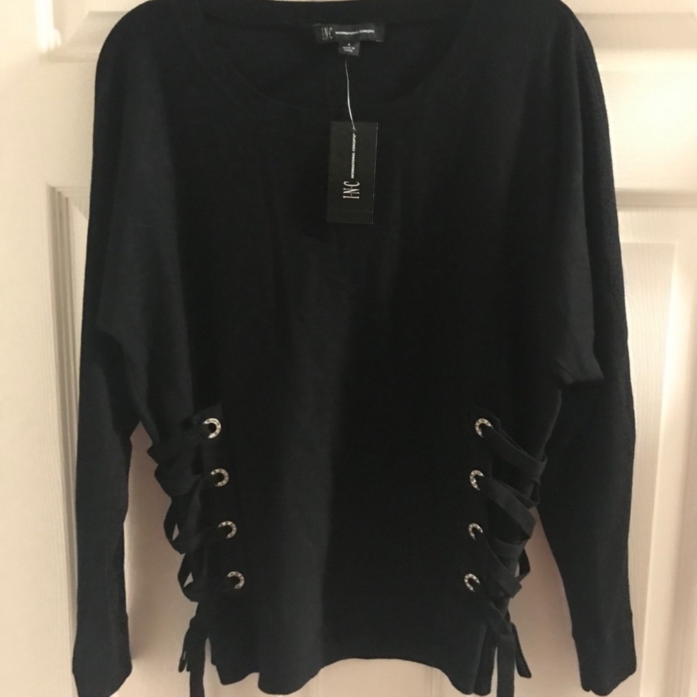 I love this sweater. 1 time use. The side has a bejewel tie down with bow.